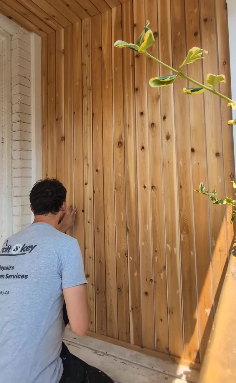 Craft and Key fitting cedar cladding on a porch rebuild